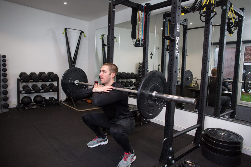 LEP Fitness personal trainer and head coach Nick Screeton doing a front squat 